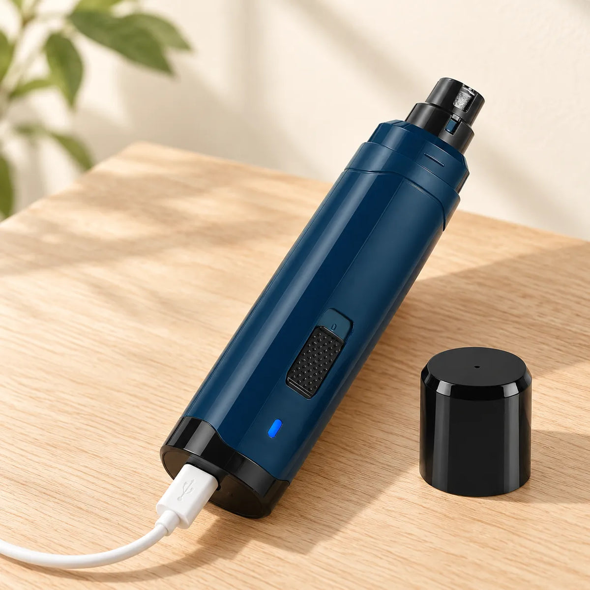 Cordless Cat Nail Grinder charging on a wooden table