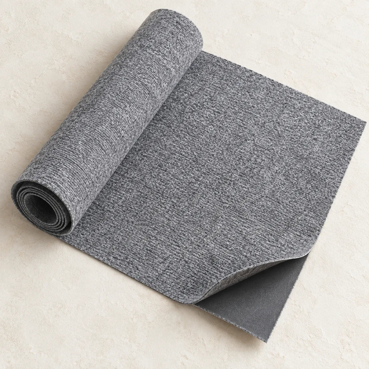 Light Gray scratch protector partly unrolled with its adhesive backing